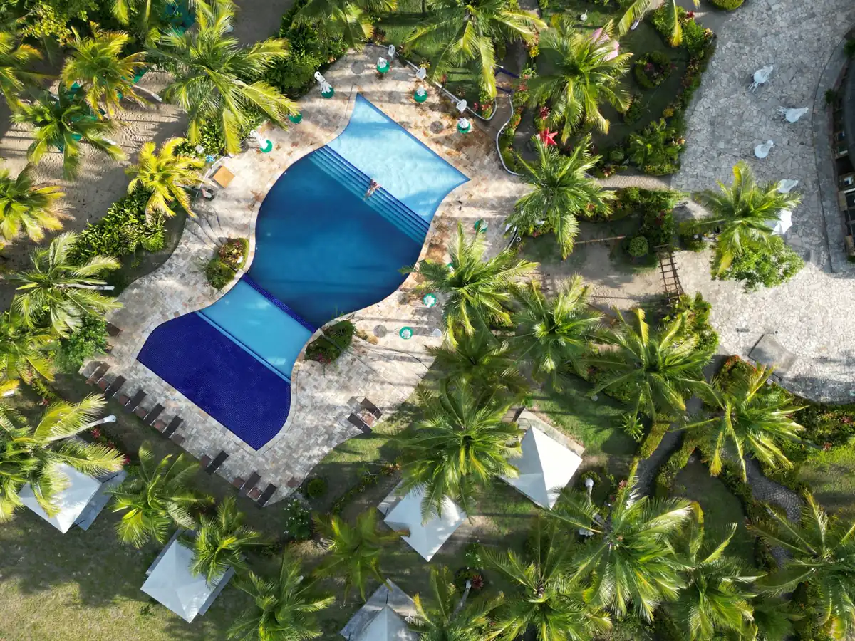 Resort pool surrounded by palms in Punta Cana